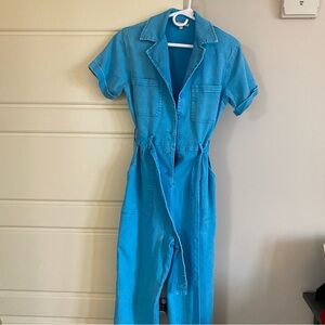 Blue denim jumpsuit with tie waist. Size XS